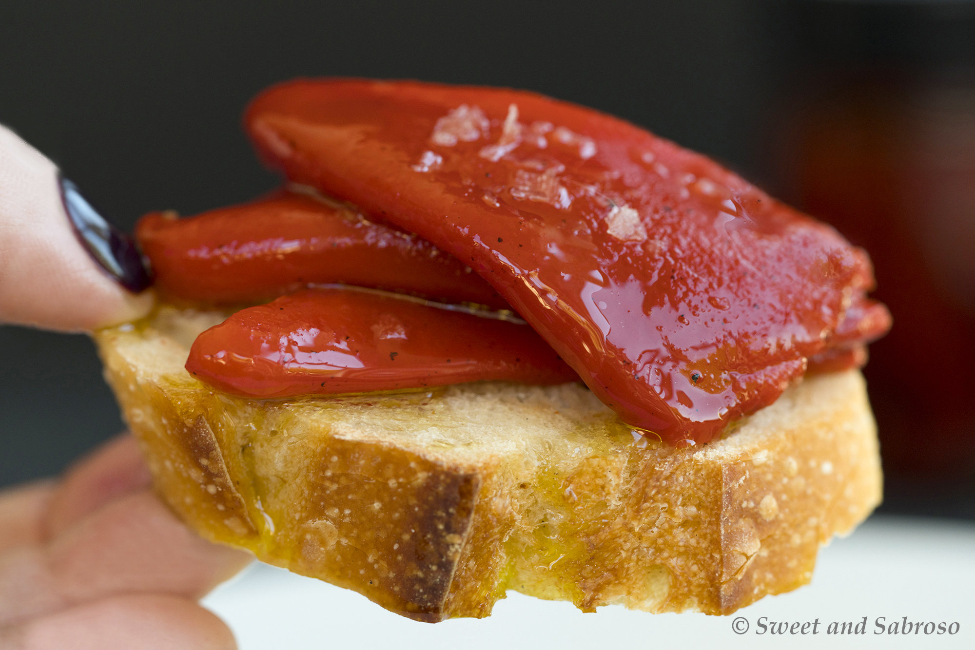 Piquillo Peppers from Spain on a slice of crusty bread with salt and olive oil