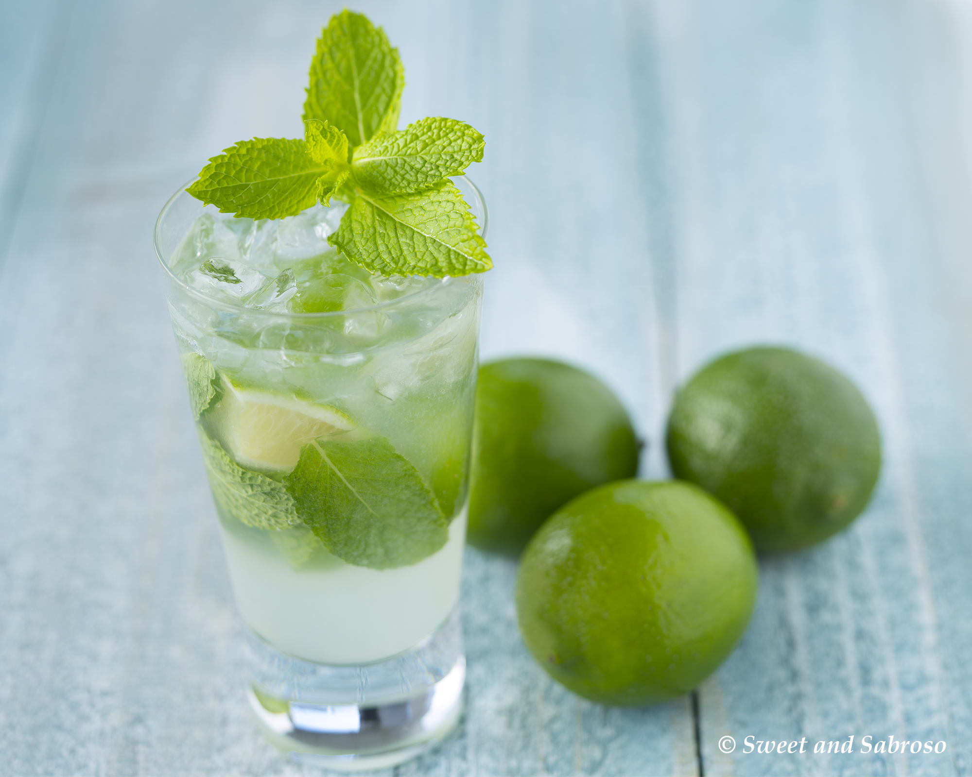 Cuban Mojito Cocktail in Highball Glass with Limes