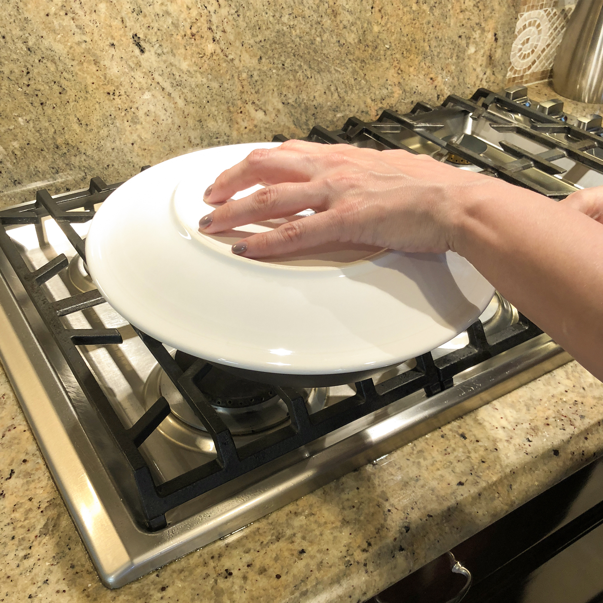 Tortilla baking on a camal skillet on the stove top. Stock Photo