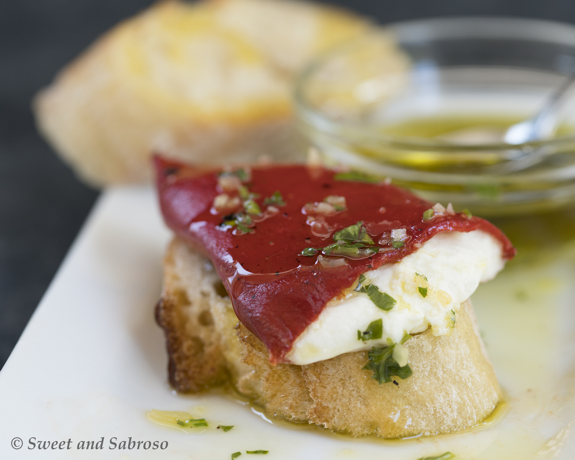 Goat Cheese Stuffed Piquillo Peppers (Pimientos de Piquillo) with Garlic Parsley Oil and Crusty Bread